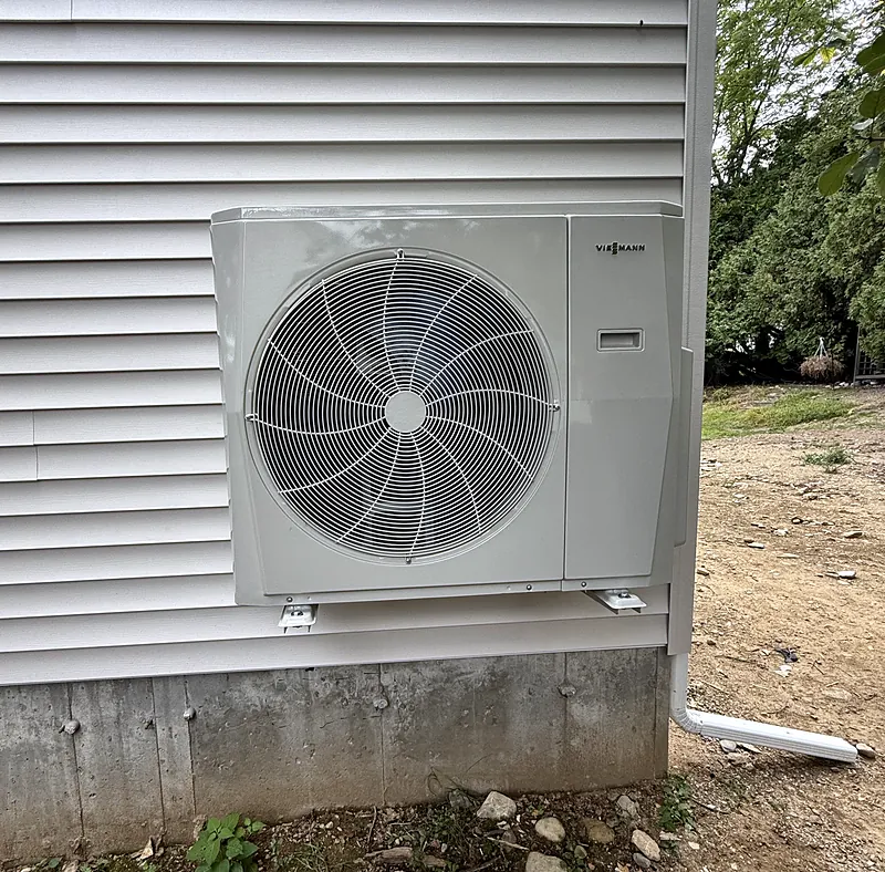 Viessmann heat pump outdoor unit mounted on a wall bracket